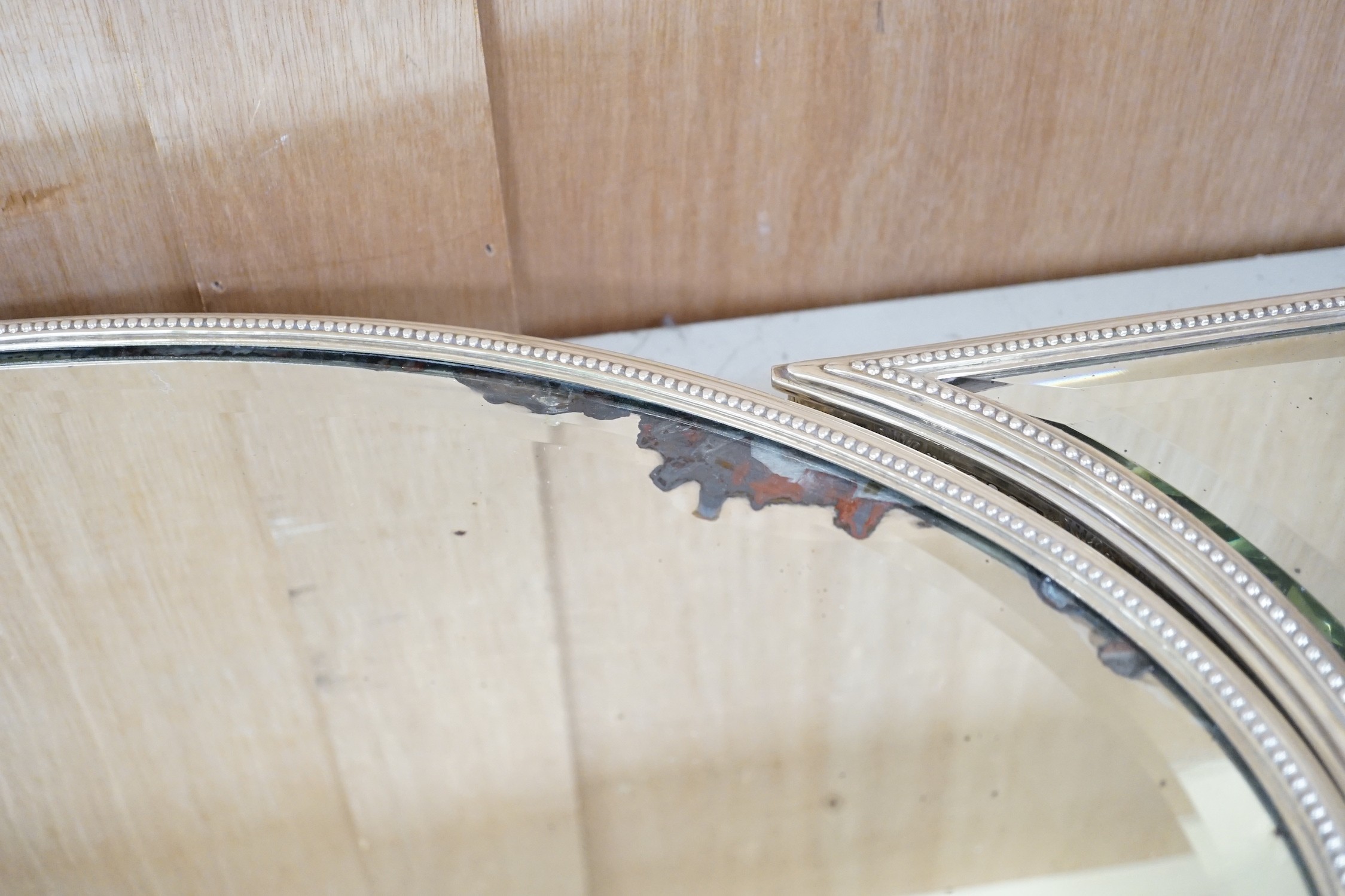 A silver-plated three-section mirrored plateau (surtout de table), by WMF, centre measures 53cm long